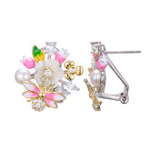 A pair of silver gold plated earrings with pearls, shell flowers and a pink butterfly charm.